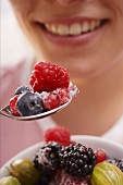 Woman eating sugared berries