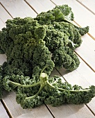 Kale on wooden background