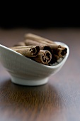 Cinnamon sticks in small bowl