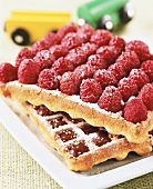 Waffles with chocolate and raspberries for children