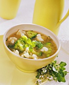 Cauliflower soup with broccoli and fresh herbs