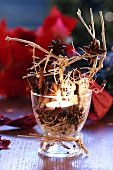 Christmas table decoration with spices and candle