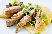 Tuna fillet on celeriac slices with watercress and sesame
