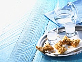 Diples (deep-fried Greek pastry bows) and ouzo