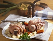 Eisbein (pork knuckle) with sauerkraut, carrots & pea puree