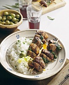 Pinchitos: kebabs with olives, rice and red wine (Spain)