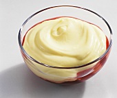 Vanilla quark with cherry sauce in glass bowl