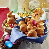 Easter Bunnies made of yeast dough and coloured eggs