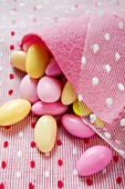 Sugared almonds in pink felt bag
