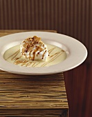 Ile flottante with flaked almonds in crème anglaise