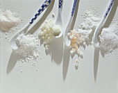 Various types of salt with spoons