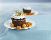 Warm chocolate pudding with physalis and cream