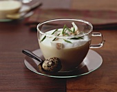 Creamed mushroom soup with quail's egg in glass cup