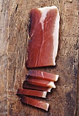 S. Tyrolean bacon on wooden background