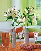 White lilies in ceramic bottles
