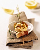 Fish and shrimps skewered on rosemary stalk