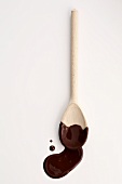 Wooden spoon with chocolate sauce