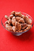 Assorted nuts to nibble in glass bowl
