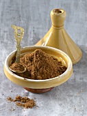Baharat spice in yellow bowl and on spoon
