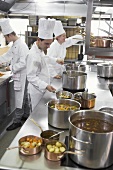Chefs at work in a commercial kitchen
