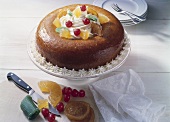 Baba au rhum (yeast cake soaked in rum with candied fruit)