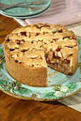 Apple and cranberry cake, a piece taken