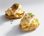 White bread topped with scrambled egg & smoked trout fillet
