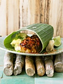 Cod with mashed potato in banana leaf (Japan)