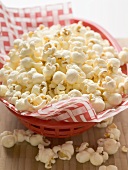 Popcorn on napkin in red basket