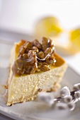 Piece of cheesecake topped with glazed almonds for Easter