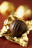 Chocolate truffles in gold foil