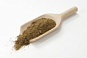 Djah Oftadeh (spice mixture from Persia) in wooden scoop