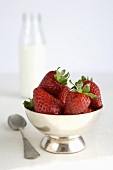 Fresh strawberries in a silver bowl