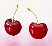 Two cherries with drops of water