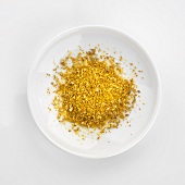 Curry powder in white dish (overhead view)