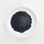 Black cumin in white dish