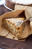 Piece of Californian nut pie in paper bag