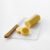 Marzipan on chopping board with knife