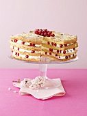 Layer cake filled with cream and redcurrants