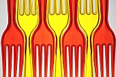 Red and yellow plastic forks