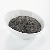 Poppy seeds in white bowl