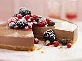 Cheesecake with berries, a piece removed