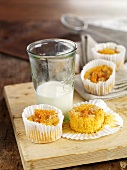 Muffins in paper cases and glass of milk