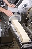 Shaping butter into blocks by machine