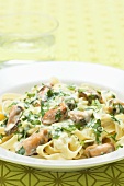 Ribbon pasta with shellfish and chopped parsley