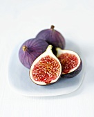 Fresh figs, whole and halved, on plate
