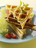 Savoury waffles garnished with lettuce and tomato
