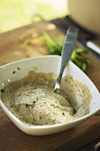 Aubergine dip in bowl with spoon