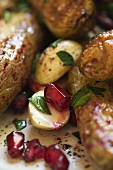 Roasted potatoes with nuts, pomegranate seeds and parsley