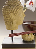 Buddha head and chopsticks